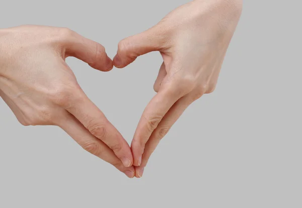 Weiße Hand auf perfektem grauen Hintergrund — Stockfoto