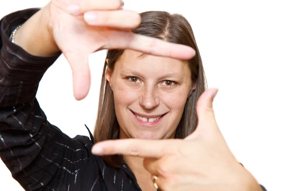 Fiatal nő portréja létrehoz egy keret kézzel — Stock Fotó
