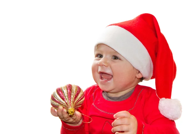 Dolce bambino sorridente in cappello Babbo Natale — Foto Stock