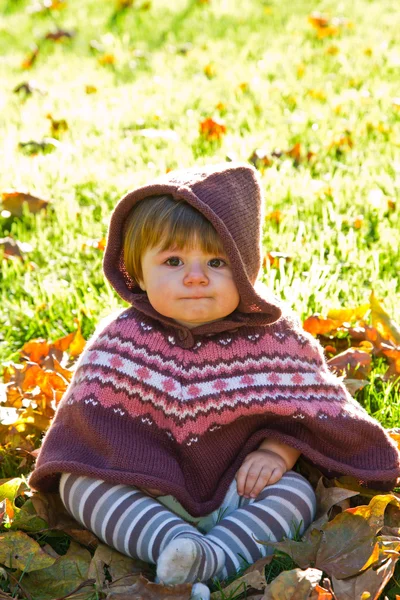Baby with autumn leaf — Stock Photo, Image
