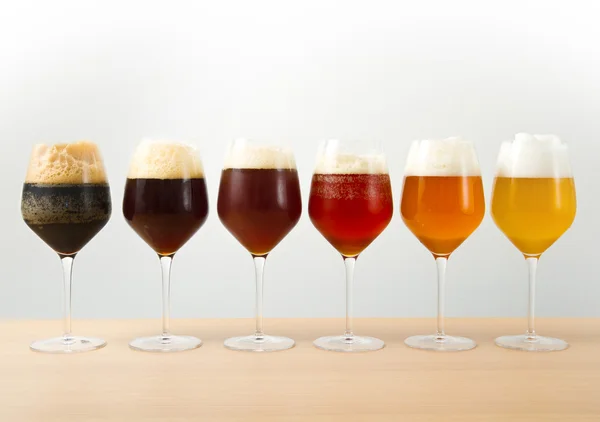 Six glasses with different beers — Stock Photo, Image