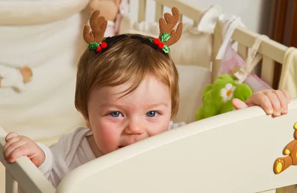 Cute little baby with reindeer hat — Stock Photo, Image