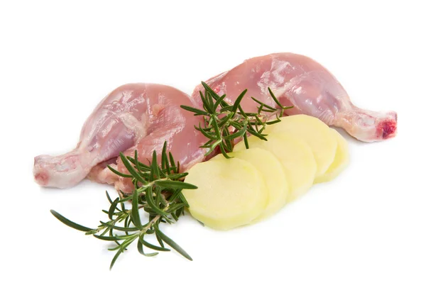 Raw chicken thighs with potatoes Royalty Free Stock Images