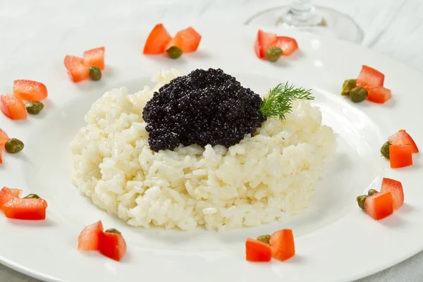 Rice with black caviar — Stock Photo, Image