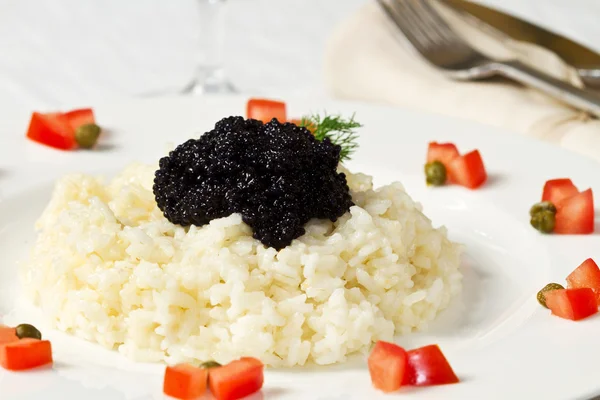 Rice with black caviar — Stock Photo, Image