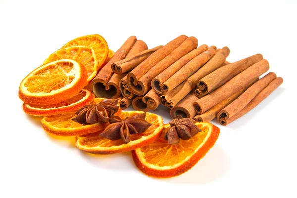 Cinnamon sticks, star anise and dried orange cuts — Stock Photo, Image