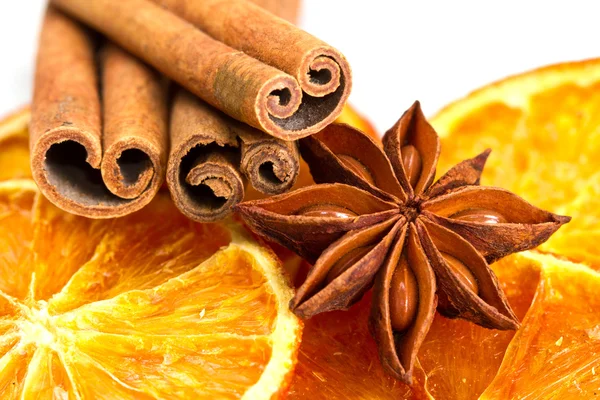 Cinnamon sticks, star anise and dried orange cuts — Stock Photo, Image