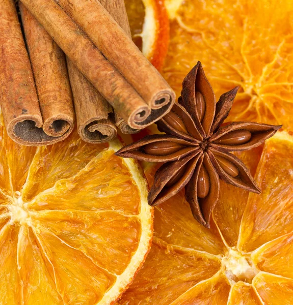 Cinnamon sticks, star anise and dried orange cuts — Stock Photo, Image