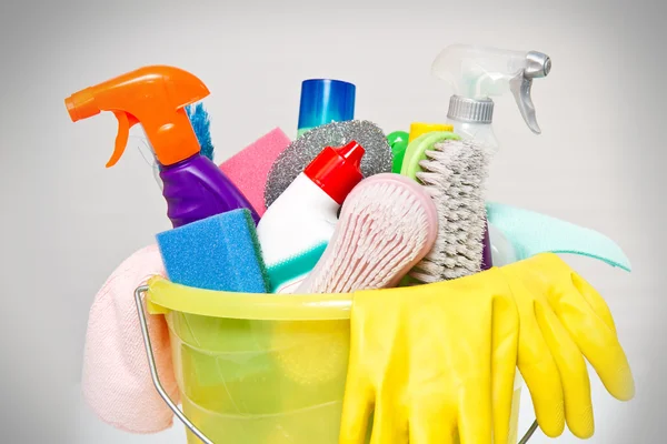 Full box of cleaning supplies and gloves isolated on white — Stock Photo, Image