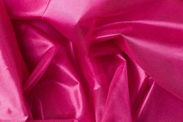 ピンクのシルク生地の背景 — ストック写真