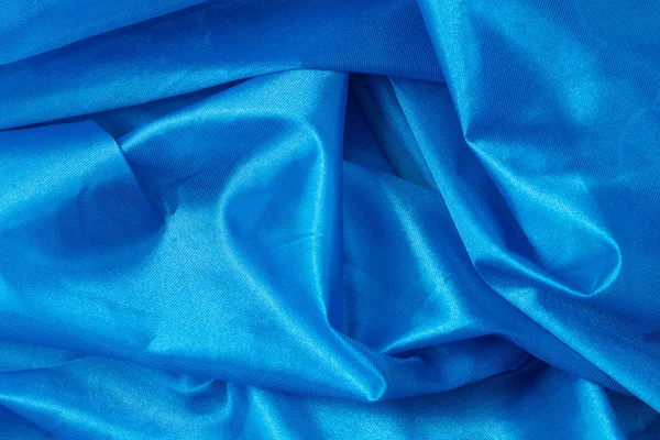 Fondo de tela de seda azul — Foto de Stock