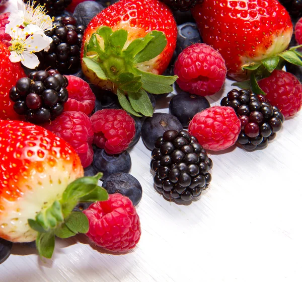 Berries on white Wooden Background — Stock Photo, Image