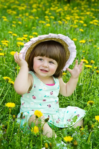 Happy girl on the meadow with white flowers — Stock Photo, Image