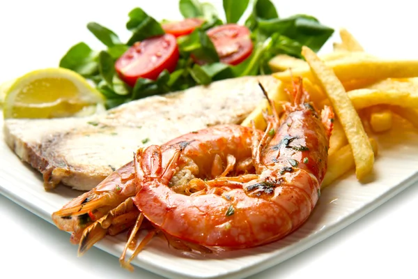 Swordfish and grilled prawns with potatoes — Stock Photo, Image