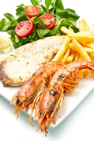 Swordfish and grilled prawns with potatoes — Stock Photo, Image