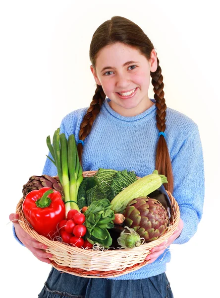 Young teenager with a vegetables basket — Stock Photo, Image