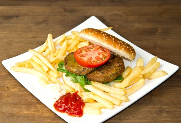 Hamburger bun with fries — Stock Photo, Image