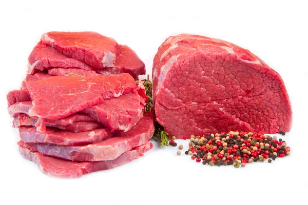 Huge red meat chunk and steak isolated over white background — Stock Photo, Image