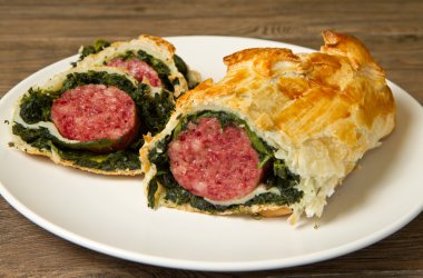italian cotechino in crust with spinach clipart