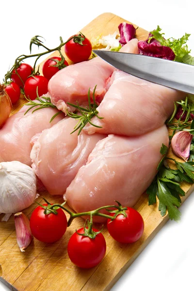 Raw chicken breasts on cutting board — Stock Photo, Image