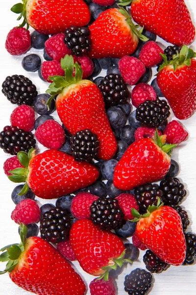 Berries on white Wooden Background — Stok Foto