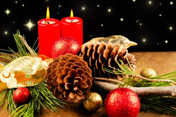 Christmas candle with pine cone — Stock Photo, Image