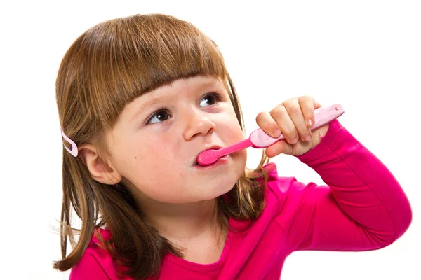Pouco sorridente encaracolado menina escovar dentes — Fotografia de Stock