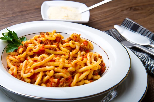 Pasta with bolognaise sauce and herbs — Stock Photo, Image