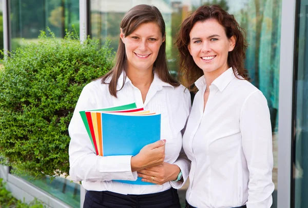 Female students with notebook — Stock Photo, Image