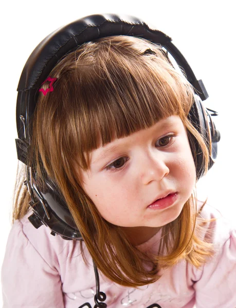 Linda menina feliz bonito com fones de ouvido — Fotografia de Stock