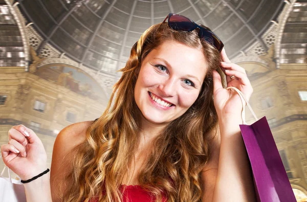 Happy shopping girl holding bags — Stock Photo, Image