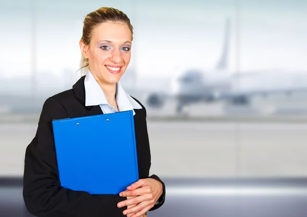 Attractive young businesswoman portrait in the airport — Stock Photo, Image