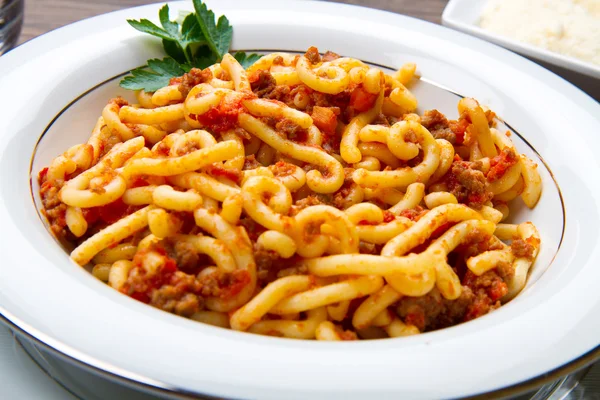 Pasta with bolognaise sauce and herbs — Stock Photo, Image