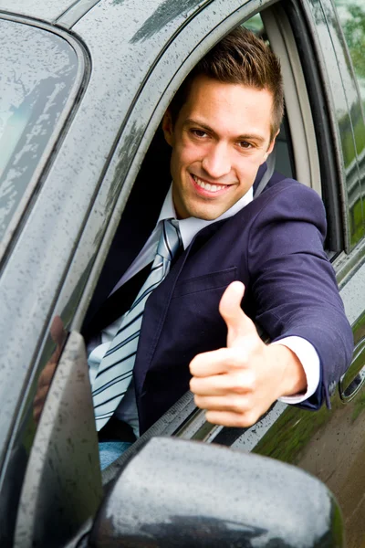 Happy man in his new car Stock Picture