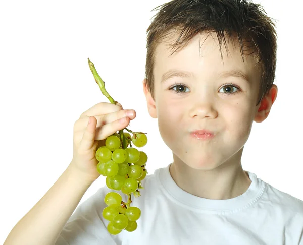 Niño con uvas —  Fotos de Stock