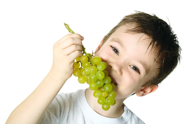 Niño con uvas — Foto de Stock