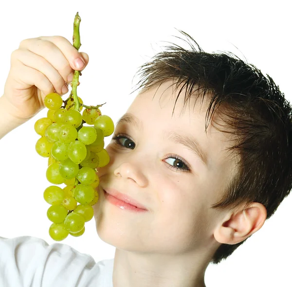 Niño con uvas — Foto de Stock