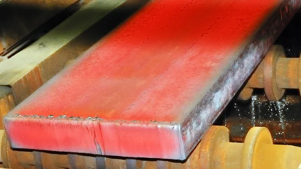 Hot steel on conveyor — Stock Photo, Image