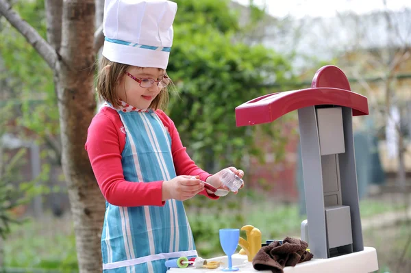 Little girl playing cooking — Stock Photo, Image
