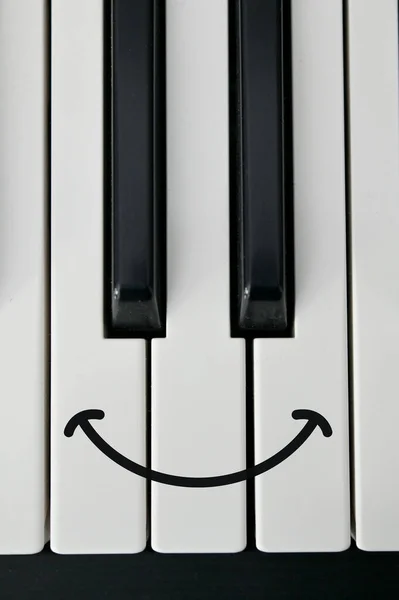 Abstract Shot Of Piano Keyboard and Draw Happy Smile