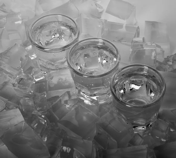 Three glass on ice background — Stock Photo, Image