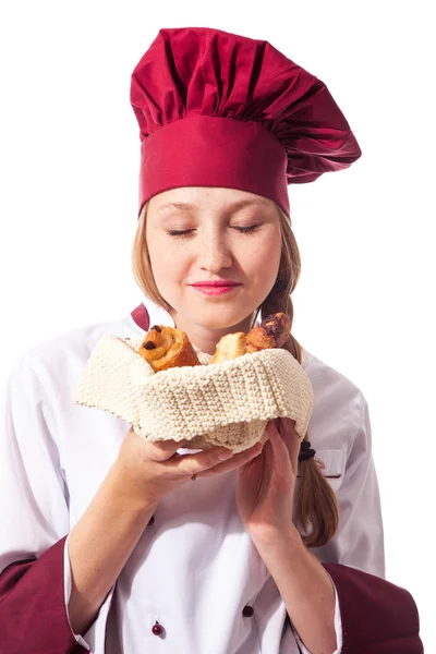 Vrouwelijke chef-kok met croissant — Stockfoto