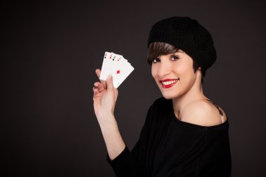 Smiling girl with french style outfit with four aces clipart