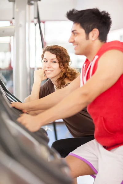 Man is doing workout on a bicycle at the gym — Stock Photo, Image