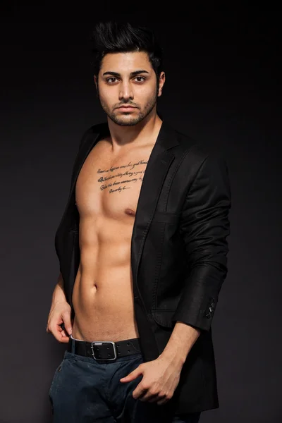 Sexy man with great abs over black isolated background — Stock Photo, Image