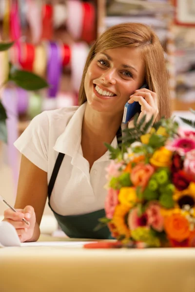 Florist is phoning — Stock Photo, Image