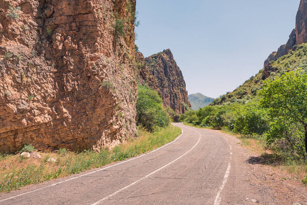 View of a road in a narrow picturesque gorge of Gnishik river in a national park in Armenia near Noravank monastery