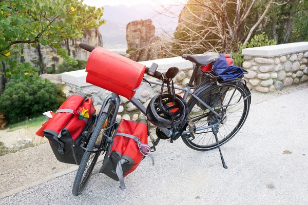Mountain bike packed with modern gear and various bags. Concept of cycle equipment and luggage