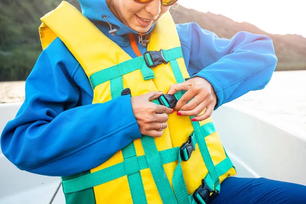 Woman Fastens Life Jacket While Traveling Boat Safety Emergency Concept — Stock Photo, Image