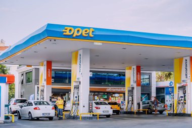 10 July 2022, Antalya, Turkey: Motorists fill their cars with gasoline and diesel at the Turkish Opet gas station. The concept of inflation and expensive prices for petroleum products